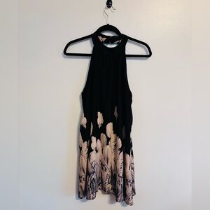 Caramela high neckline black mini dress with cutout in the back and feather